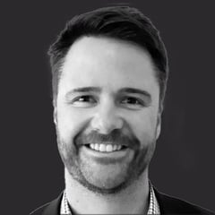 Headshot of Adam Hughes
