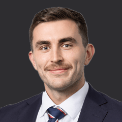 Headshot of Tomhas Curtin